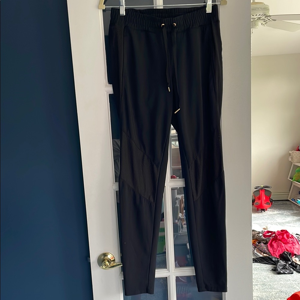 Alala Black Joggers.  Mesh sides.